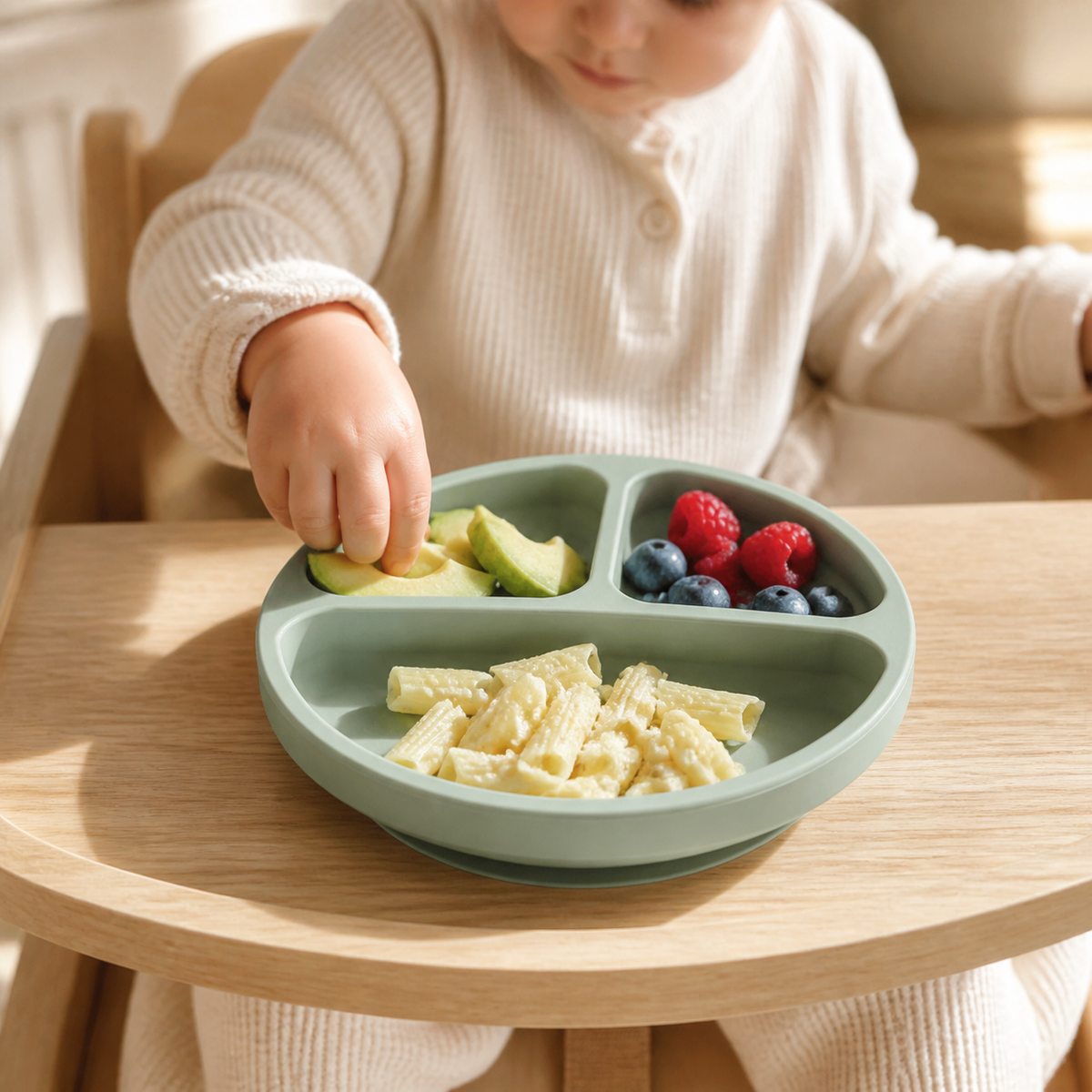 Child using the YumBella Silicone Suction Plate at mealtime