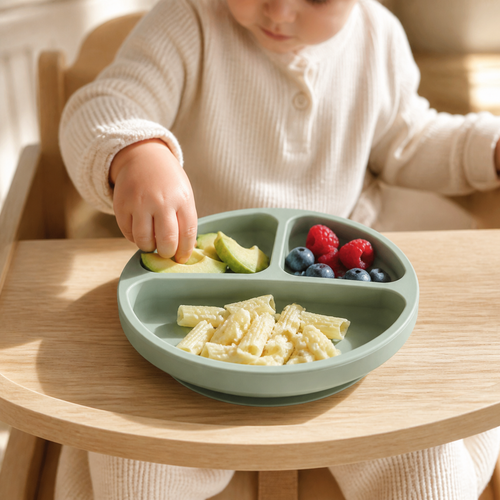 Child using the YumBella Silicone Suction Plate at mealtime